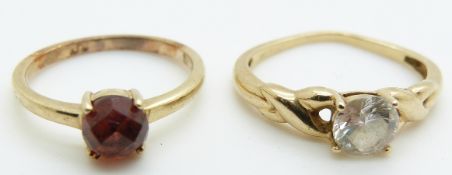 A 9ct gold ring set with cubic zirconia and another 9ct gold ring set with a garnet, 4.6g,