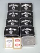 Nine packs of Jack Daniels playing cards, one pack of Stella Artois playing cards and one pack of