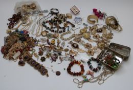 A collection of jewellery including amber bracelet, Exquisite brooch, vintage brooches, necklaces