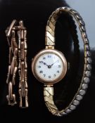 Vintage 9ct gold ladies wristwatch with blued hands, black Arabic numerals, white enamel dial and