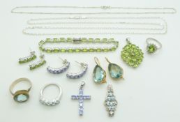 A collection of silver earrings and pendants set with peridot and amethyst
