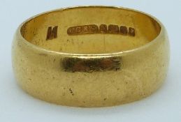 A 22ct gold wedding band, Birmingham hallmark, 7.1g, size N/O