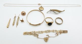 A 9ct gold christening bangle, 9ct gold ring, 9ct gold gate bracelet and a 9ct gold eternity ring