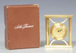 Seth Thomas French-made brass cased boudoir alarm clock, the gilt dial with Roman cartouche figures,