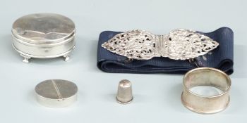 Hallmarked silver belt buckle, hallmarked silver trinket pot raised on four feet, silver napkin