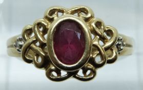 A 9ct gold ring set with an oval cut garnet, 2.8g, size P