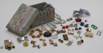 A collection of costume jewellery including jet brooch, silver brooch, diamanté necklaces etc