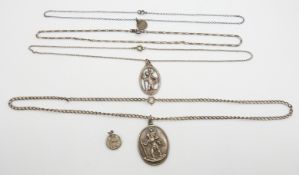 Four silver St Christopher pendants and silver chains
