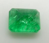 A loose emerald cut emerald measuring approximately 7.8ct