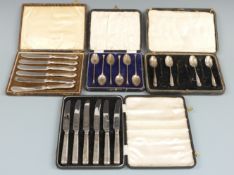 Two cased sets of hallmarked silver handled knives, one by Viners together with two cased sets of