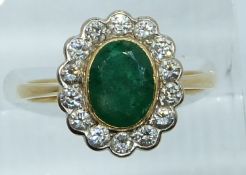 An 18ct gold ring set with an emerald and diamonds, 4g, size N/O
