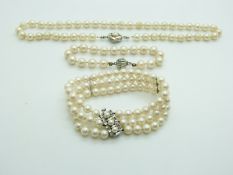 A single strand of cultured pearls with a 14ct white gold clasp set with a pearl, cultured pearl