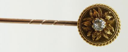 Victorian 18ct gold stick pin set with a diamond of approximately 0.15ct in a floral surround and