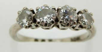 An 18ct white gold ring set with four diamonds, each approximately 0.25ct, 3.5g, size M