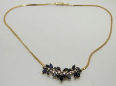 An 18ct gold necklace set with marquise cut sapphires and diamonds, 18g