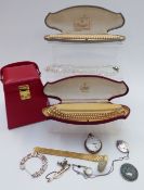 A collection of jewellery including silver locket, silver ring, silver gate bracelet, white metal