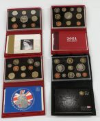 Four Royal Mint cased UK Proof Collection coin sets for 2001, 2002, 2004 and 2008, with