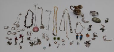 A collection of silver jewellery including Wedgwood brooch, pendants, earrings, a Butler and