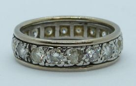 An 18ct white gold eternity ring set with diamonds, each approximately 0.1ct, total weight