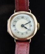 Vintage 9ct gold ladies wristwatch with blued hands, black Arabic numerals and silver dial, on red