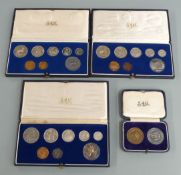 Four cased South Africa brilliant uncirculated coin sets, each including a silver coin, to include
