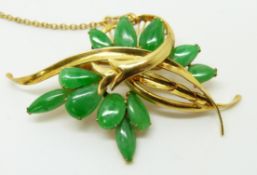 A 14k gold brooch set with pear cut jade cabochons, 5 x 3cm