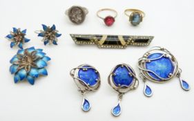 A silver brooch set with blue enamel with matching earrings, a silver brooch in the form of a flower