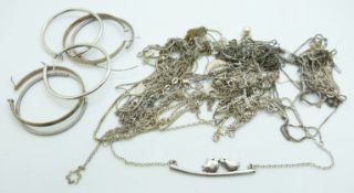 A collection of silver chains/necklaces and hoop earrings