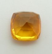 A loose cushion cut orange sapphire measuring approximately 6.55ct