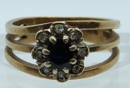 A 9ct gold ring set with a sapphire and diamonds, 3.6g, size J/K