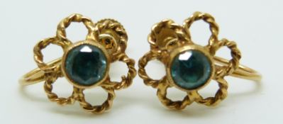 A pair of 9ct gold earrings set with a round cut zircon to each, in Asprey box, 2.8g