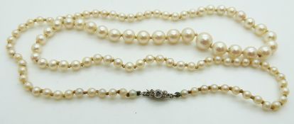 A single strand cultured pearl necklace with diamond set clasp