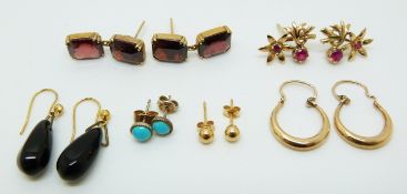 A pair of 9ct gold earrings set with synthetic rubies (2.3g), a pair of yellow metal earrings set