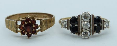 Two 9ct gold rings, one set with garnets the other with sapphires and cubic zirconia, 3.8g