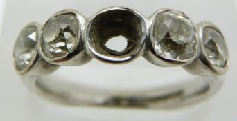 An 18ct white gold ring set with four old cut diamonds of approximately 0.33ct each, 6g, size O