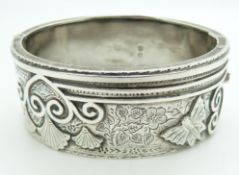Victorian silver bangle with engraved and embossed decoration depicting a butterfly, Birmingham