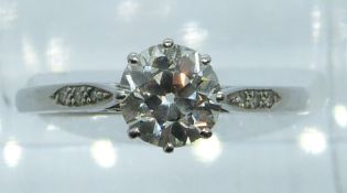 Art Deco platinum ring set with a diamond of approximately 1ct and with diamond encrusted shoulders,