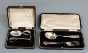 Cased hallmarked silver fork and spoon set together with a cased hallmarked silver baby's spoon and