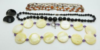 A silver necklace set with pressed amber, French jet earrings and necklace and a mother of pearl