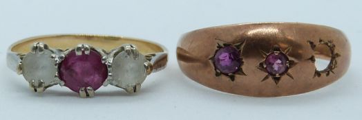 A 9ct gold ring set with rubies and a yellow metal ring set with a ruby and paste, 3.9g