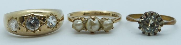 A 9ct gold ring (3g), a silver gilt ring set with paste and another ring