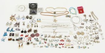 A large collection of silver earrings