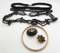 Victorian rolled gold flapper bangle, jet brooch inlaid with mother of pearl, French jet necklaces