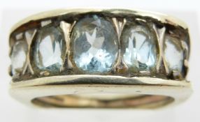 A 9ct gold ring set with an aquamarines, 6.6g, size N