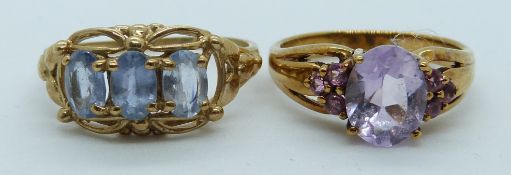 A 9ct gold ring set with three oval cut sapphires and a 9ct gold ring set with an amethyst, 5.9g