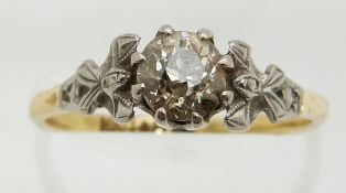 An 18ct gold ring set with a diamond of approximately 0.71ct in a platinum setting, 2.6g, size O