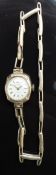 Slava 9ct gold ladies wristwatch with gold hands and hour markers and silver dial, on 9ct gold
