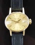 Marvin 9ct gold ladies wristwatch with gold hands, baton markers and dial and signed 17 jewel