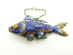A silver fish pendant set with enamel, 7 x 3cm