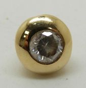 An 18ct gold pendant set with a round cut diamond of approximately 0.18ct, 0.9g